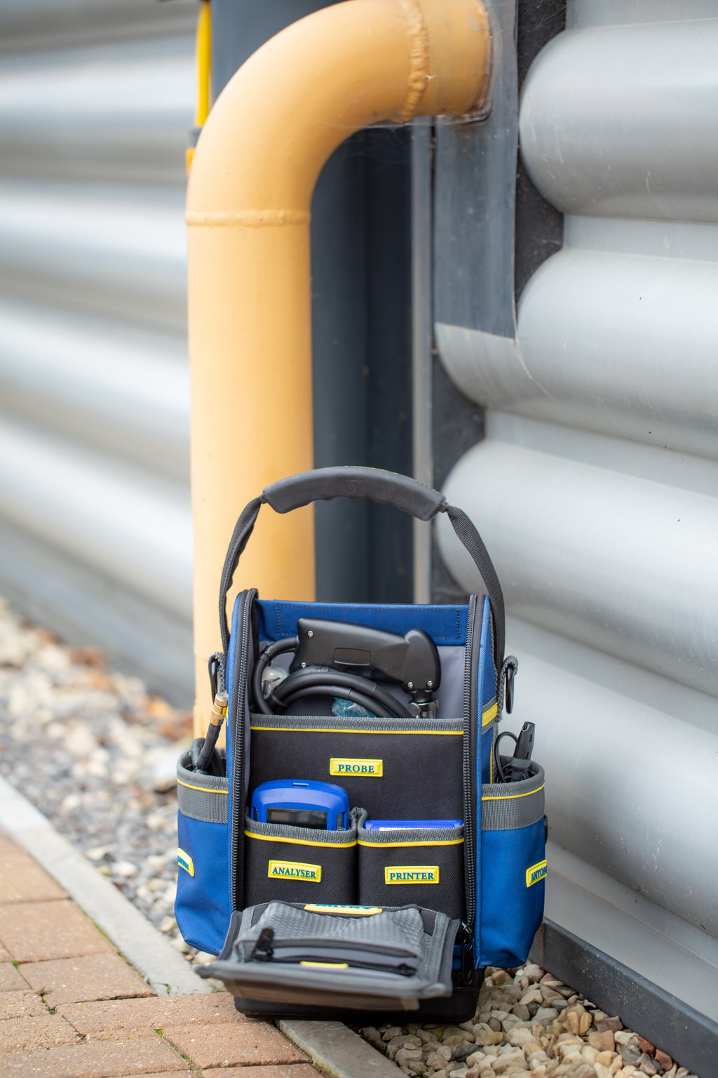Anton By Crowcon at Heating Engineer Supplies

Trade supplies Limerick
Trade supplies Ireland


Blue tool bag with tools on a ground next to a building exterior.