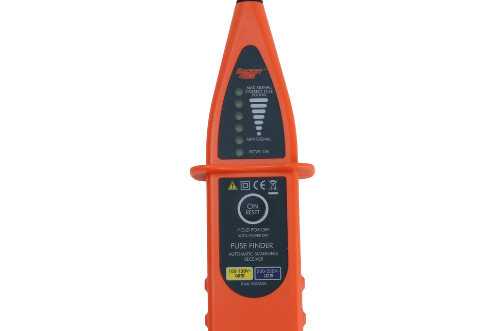 Orange electrical fuse finder on a green background